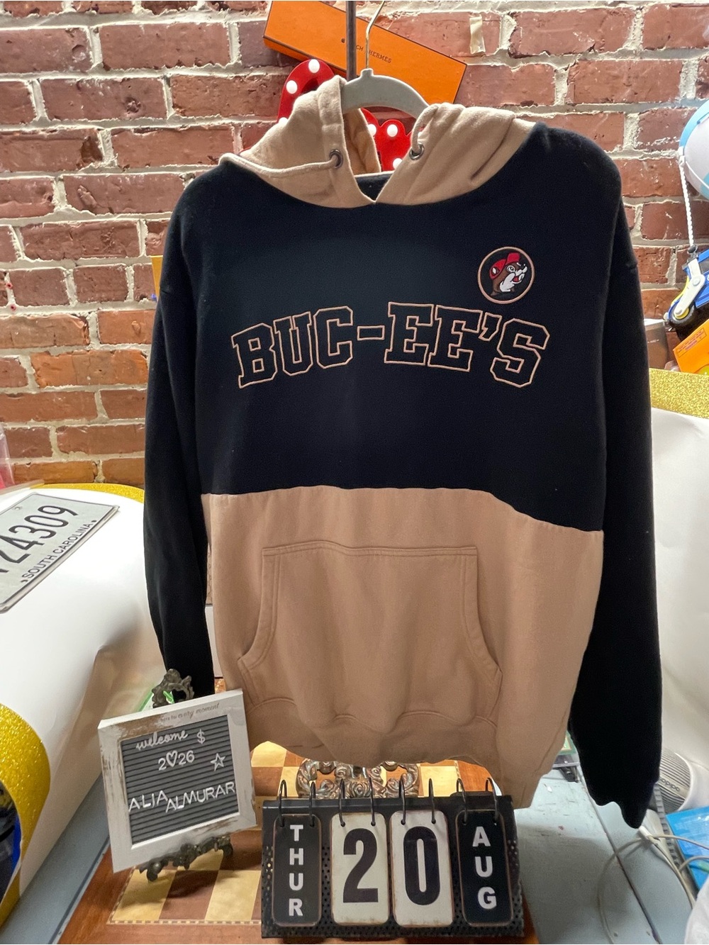 official two-toned black and tan Buc-ee's collegiate pullover hoodie